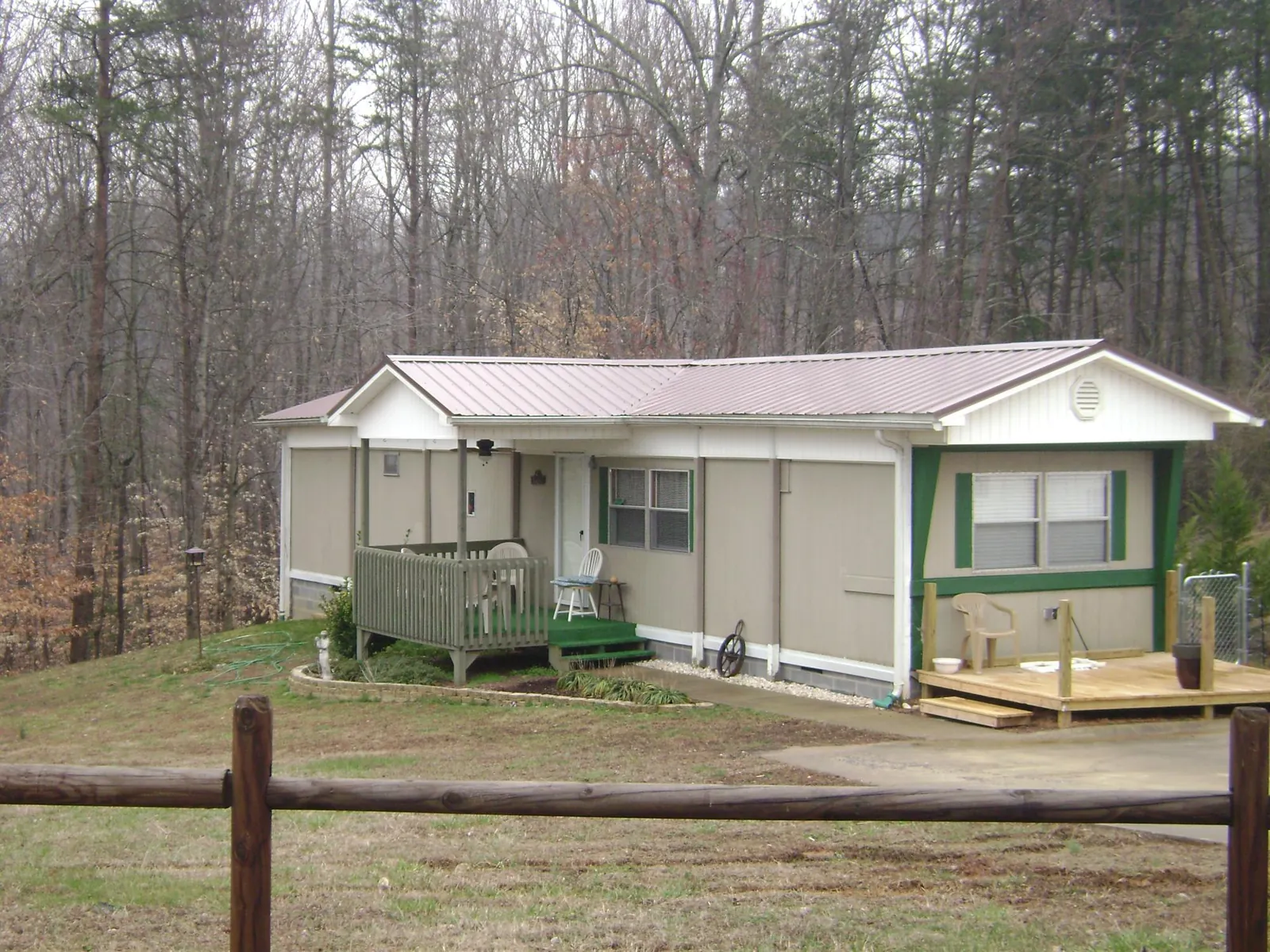 Mauve metal roof on a manufactured home with a new front deck in Watervliet